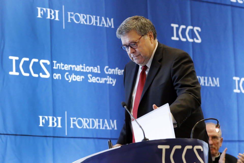 U.S. Attorney General William Barr approaches the podium to address the International Conference on Cyber Security, hosted by the FBI and Fordham University, at Fordham University in New York, Tuesday, July 23, 2019. (AP Photo/Richard Drew)