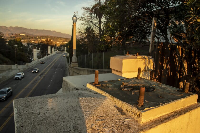 LOS ANGELES, CA - January 03 2022: Large bolts remain where a bronze streetlight is missing from the Hyperion Bridge Monday, Jan. 3, 2022 in Los Angeles, CA. 17 lights have been stolen, and the LA Bureau of Street Lighting has proactively removed and stored 18 lights. (Brian van der Brug / Los Angeles Times