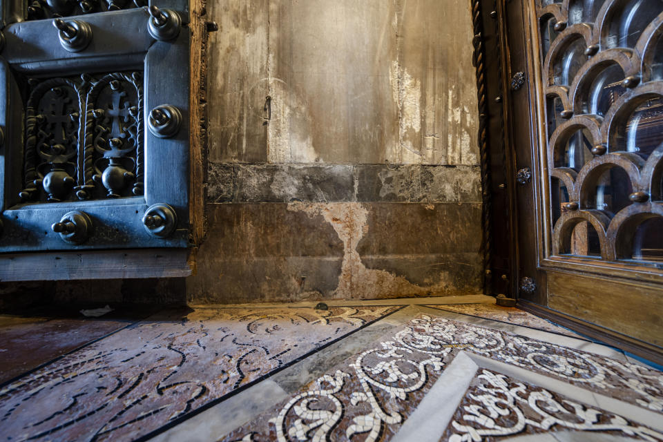 Signs of erosion are visible inside St. Mark's Basilica in Venice, northern Italy, Wednesday, Dec. 7, 2022. Glass barriers that prevent seawater from flooding the 900-year-old iconic Venice's Basilica during high tides have been recently installed in St. Mark's Square which is the lowest-laying city area and frequently ends up underwater during extreme weather. (AP Photo/Domenico Stinellis)