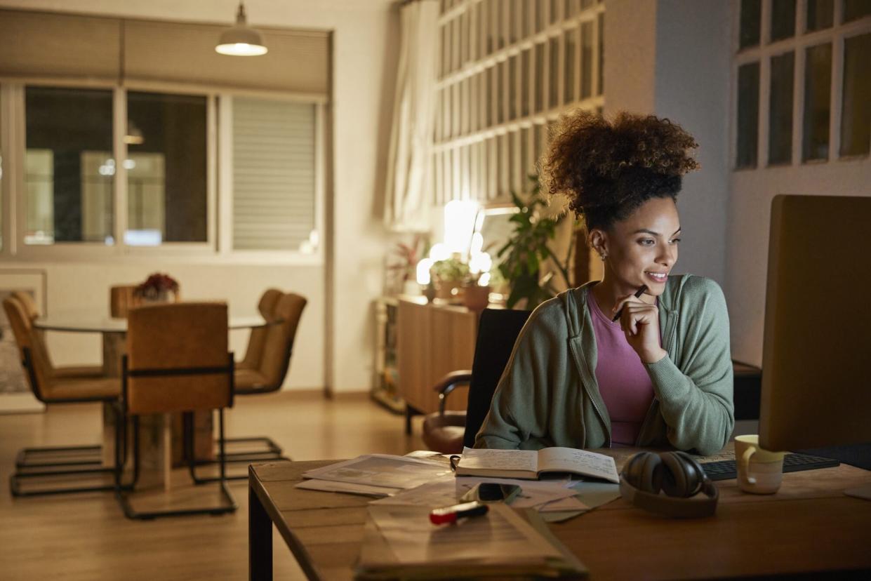 Businesswoman Working Late In Home Office