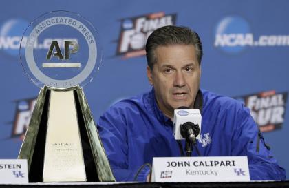 John Calipari sits by his AP College Basketball Coach of the Year trophy Friday. (AP)