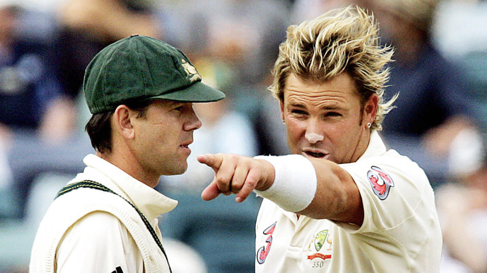 Shane Warne (pictured right) picking out a field placement to captain Ricky Ponting (pictured left).