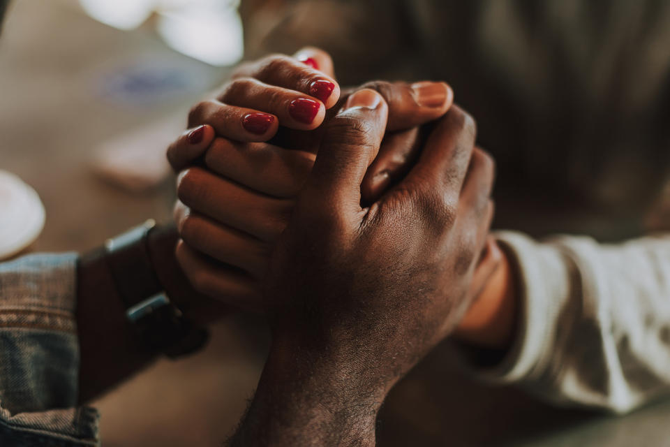 Two people holding hands.