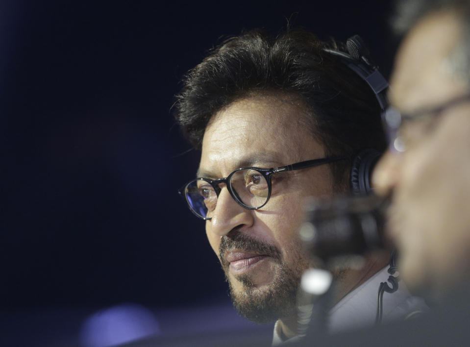 FILE- In this Oct. 23, 2017 file photo, Bollywood actor Irrfan Khan watches a Vivo Pro Kabaddi league match in Mumbai, India. Khan, a veteran character actor in Bollywood movies and one of India's most well-known exports to Hollywood, has died. He was 54. (AP Photo/Rafiq Maqbool, File)