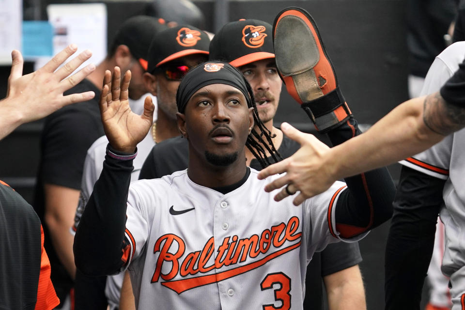 Baltimore Orioles' Jorge Mateo celebrates with teammates after scoring on a fielding error by Chicago White Sox shortstop Leury Garcia during the fifth inning of a baseball game in Chicago, Saturday, June 25, 2022. (AP Photo/Nam Y. Huh)