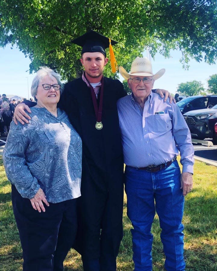 Photo: Hayden Cape, center, is congratulated by grandparents Gail and Carlton Richardson following May 7 commencement ceremonies at West Texas A&M University.