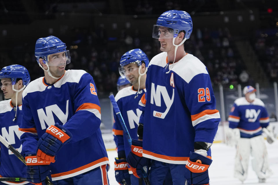 New York Islanders' Nick Leddy (2) celebrates with Brock Nelson (29) as they leave the ice after an NHL hockey game against the Philadelphia Flyers Thursday, April 8, 2021, in Uniondale, N.Y. The Islanders won 3-2. (AP Photo/Frank Franklin II)