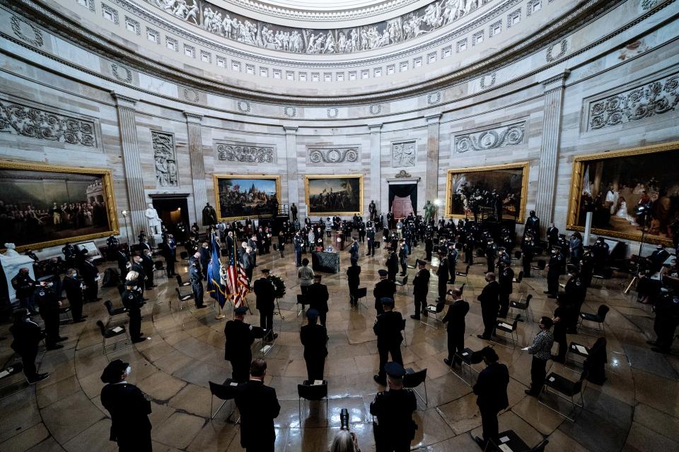 *** BESTPIX *** WASHINGTON, DC - FEBRUARY 03: Attendees participate in a moment of prayer during a congressional tribute to the late Capitol Police officer Brian Sicknick who lies in honor in the Rotunda of the U.S. Capitol on February 3, 2021 in Washington, DC. Officer Sicknick died as a result of injuries he sustained during the January 6 attack on the U.S. Capitol. He will lie in honor until February 3 and then be buried at Arlington National Cemetery. (Photo by Erin Schaff-Pool/Getty Images) ORG XMIT: 775617479 ORIG FILE ID: 1230951508