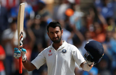 Cricket - India v Australia - Third Test cricket match - Jharkhand State Cricket Association Stadium, Ranchi, India - 18/03/17 - India's Cheteshwar Pujara celebrates his century. REUTERS/Adnan Abidi