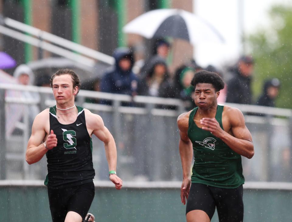 West Salem's Mihaly Akpamgbo, right, runs in the 100-meter in the MVC district championship on Friday, May 13, 2022 at McKay High School in Salem, Ore. Akpamgbo won first place in the event. 