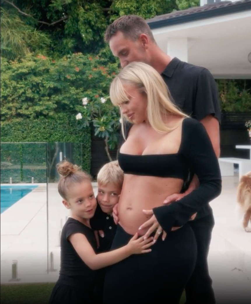 Tammy Hembrow and her children cradling her baby bump