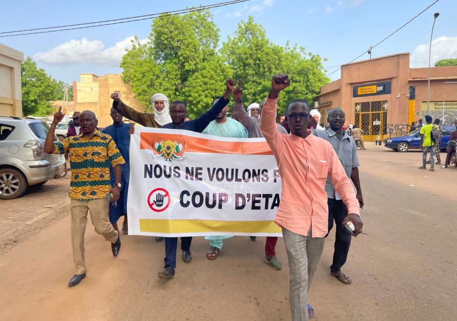 Supporters of Nigerien President Mohamed Bazoum demonstrate in his support in Niamey, Niger, Wednesday July 26, 2023. Governing bodies in Africa condemned what they characterized as a coup attempt Wednesday against Niger’s president, whose official Twitter account reported that elements of the presidential guard engaged in an “anti-Republican demonstration” and tried to obtain the support of other security forces. (AP Photo/Sam Mednick)