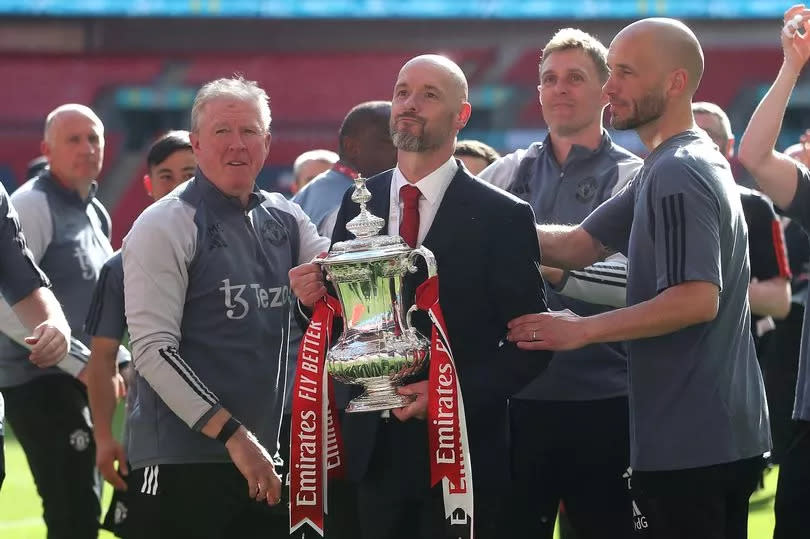 Manchester United manager Erik ten Hag celebrates winning the FA Cup with his coaching staff