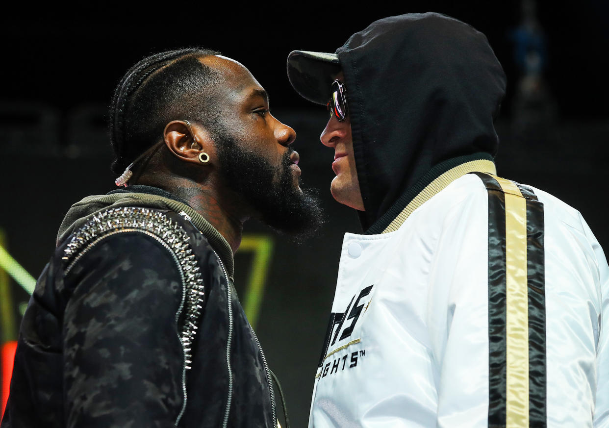 Deontay Wilder (L) and Tyson Fury face-off Wednesday at the MGM Grand Garden at the start of their final news conference for their heavyweight title fight on Saturday. (Mikey Williams/Top Rank)