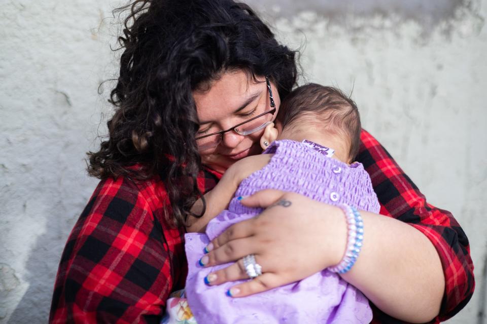 Cheyenne Hinojosa with her daughter Sophia Hinojosa after her 1st birthday celebration at their home in Huron, South Dakota. 