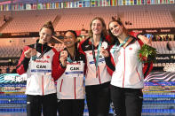 Bronze medalists team of Canada pose with their medals after the Women 4x200m Freestyle Relay final at the 19th FINA World Championships in Budapest, Hungary, Wednesday, June 22, 2022. (AP Photo/Anna Szilagyi)