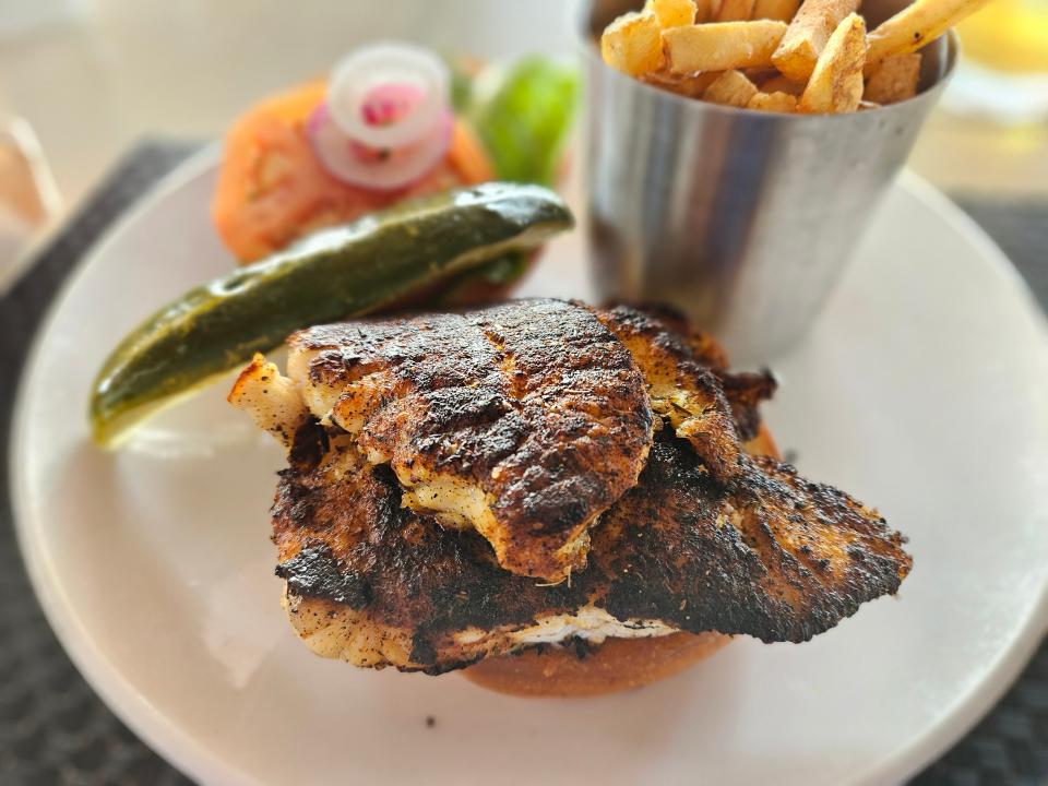 The grouper sandwich, which comes blackened with lemon aioli on a freshly baked bun, at Beach House waterfront restaurant on Bradenton Beach, Anna Maria Island. Photographed Feb. 4, 2024.