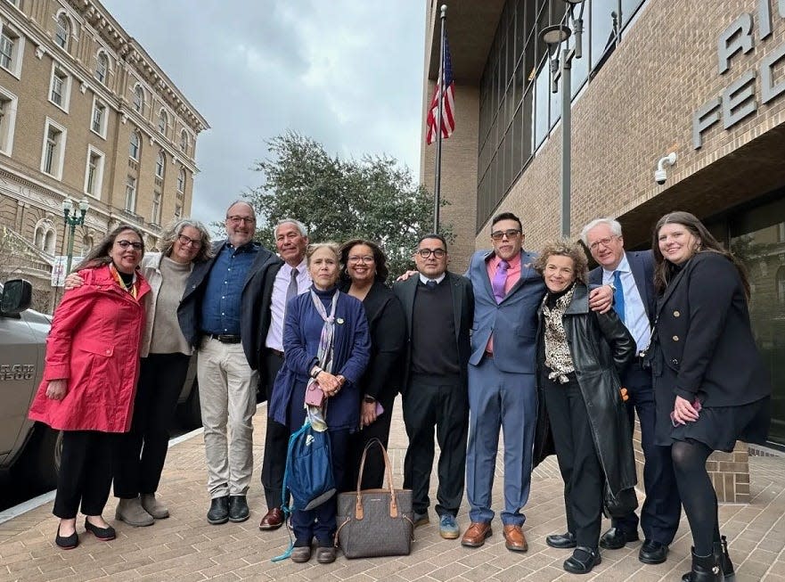 Friends and family of Emilio and Oscar Gutierrez Soto gather outside the Richard C. White Federal Building in El Paso after an immigration judge granted the two men asylum. The father and son came to the U.S. in 2008 after the father, a Mexican journalist, was threatened by the Mexican military for stories he wrote about their corruption.