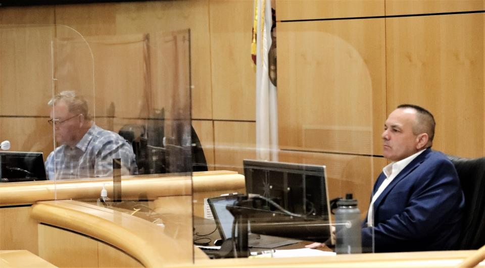 Supervisors Les Baugh, left, and Patrick Jones attend a Shasta County Board of Supervisors meeting behind plexiglass as a COVID-19 precaution on Tuesday, April 20, 2021.