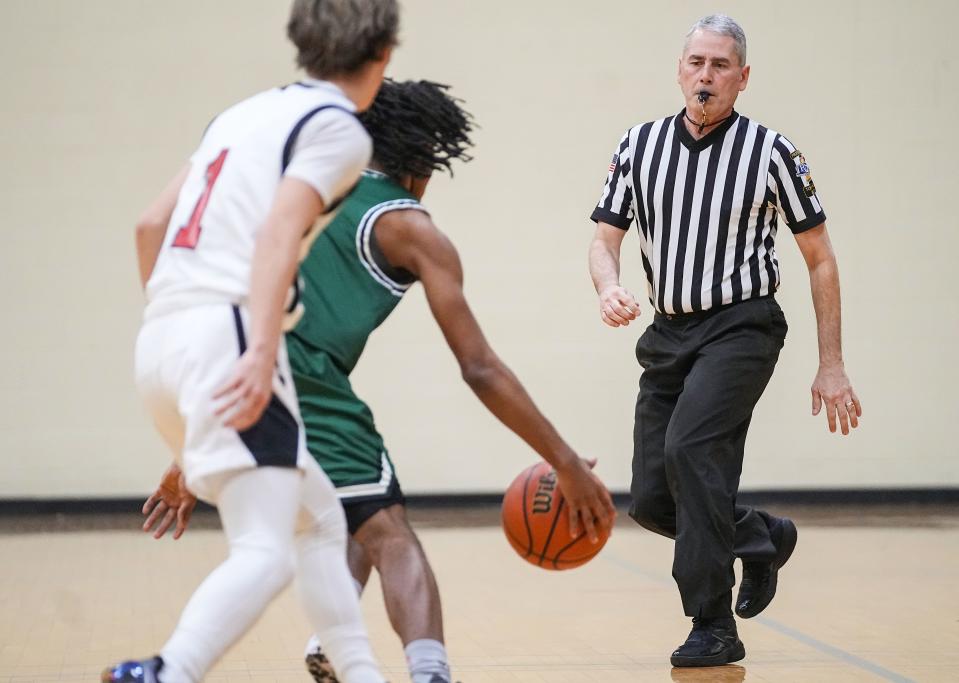 Casey Gaynor rushes up the court Tuesday, Jan. 2, 2024, during the game at Municipal Gardens in Indianapolis. Casey Gaynor, a high school basketball official, completed his journey to officiate a game at every high school in the state.