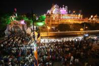 <p>Indian Hindu devotees queue to enter the Sri Krishna Janamsthan temple on the eve of ‘Krishna Janamshtami’ festival, in Mathura on September 2, 2018. – ‘Krishna Janmashtami’ is an annual Hindu festival that celebrates the birth of Krishna. (Photo by AFP/Getty Images) </p>