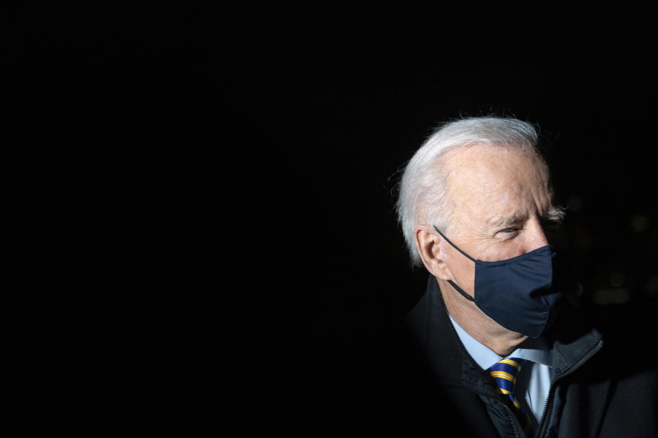 President Joe Biden speaks with a reporter on the South Lawn of the White House after stepping off Marine One, early Wednesday, Feb. 17, 2021, in Washington. Biden is returning to Washington after participating in a town hall event in Milwaukee. (AP Photo/Patrick Semansky)