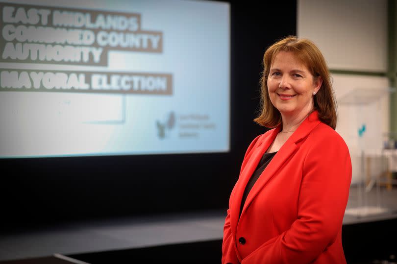 Claire Ward, the first ever East Midlands Mayor, wearing a red jacket at the Nottingham Tennis Centre count