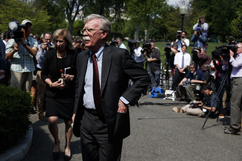 National security adviser John Bolton walks into the White House after speaking with reporters about the situation in Venezuela, Tuesday, April 30, 2019, in Washington. (AP Photo/Evan Vucci)