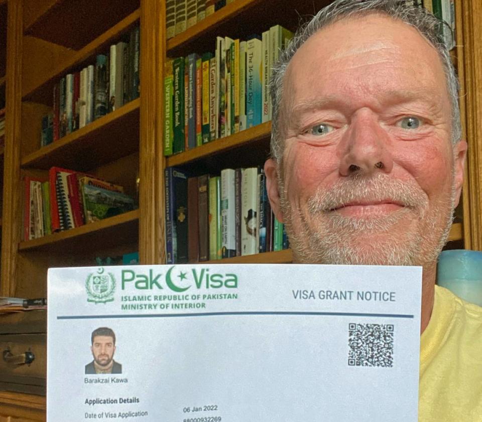 Mike Reeves of Cambria holds a copy of the hard-fought-for visa that allowed his friend and colleague, Kawa Barakzai, and his family to finally flee into Pakistan from Afghanistan, where they’ve been in hiding for five months, since U.S. troops withdrew from the war-torn country. They need to get U.S. visas by March 19, or they’ll have to return to Afghanistan, where they’re certain they’d face being killed. Reeves is among those who’ve been battling to get the family to safety.