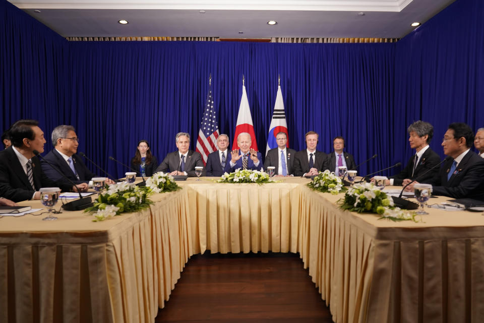 U.S. President Joe Biden, center, meets with South Korean President Yoon Suk Yeol, left, and Japanese Prime Minister Fumio Kishida, right, on the sidelines of the Association of Southeast Asian Nations (ASEAN) summit, Sunday, Nov. 13, 2022, in Phnom Penh, Cambodia. (AP Photo/Alex Brandon)