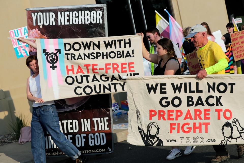 Transgender rights activists and citizens protest prior to the start of an Outagamie County Board meeting at the Outagamie County Government Center Tuesday, May 23, 2023, in Appleton, Wis. At a May 9 county board meeting, member Timothy Hermes made transphobic comments regarding transgender people and their use of bathrooms that align with their gender, calling them "disgusting."Dan Powers/USA TODAY NETWORK-Wisconsin. 