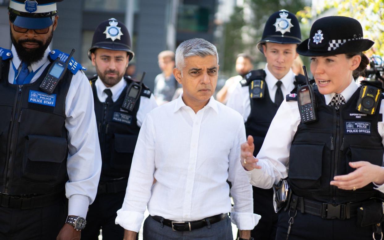 Sadiq Khan meets a neighbourhood policing team during a visit to Tottenham, north London, earlier this month - Stefan Rousseau /PA