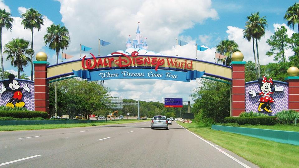 Photo shows car driving into Walt Disney World entrance in Orlando, Florida