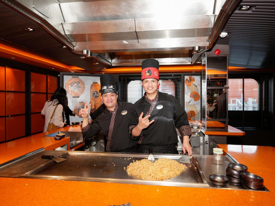 Two chefs in front of teppanyaki in the MSC Meraviglia