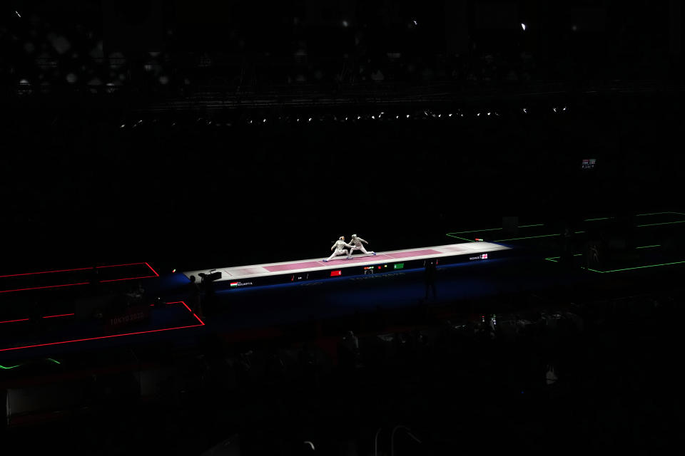 FILE - Fencers compete in the men's individual semifinal Sabre competition at the 2020 Summer Olympics, on July 24, 2021, in Chiba, Japan. Four national fencing federations say the International Fencing Federation has voted to allow athletes from Russia and its ally Belarus to resume competing in international events. They have been excluded for more than a year because of the invasion of Ukraine. The decision appears to allow Russians and Belarusians to compete for qualifying spots for next year’s Paris Olympics. (AP Photo/Hassan Ammar)