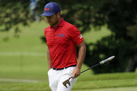 Xander Shauffele of United States walks on 17th green during the first round of the men's golf event at the 2020 Summer Olympics, Friday, July 30, 2021, at the Kasumigaseki Country Club in Kawagoe, Japan, (AP Photo/Matt York)