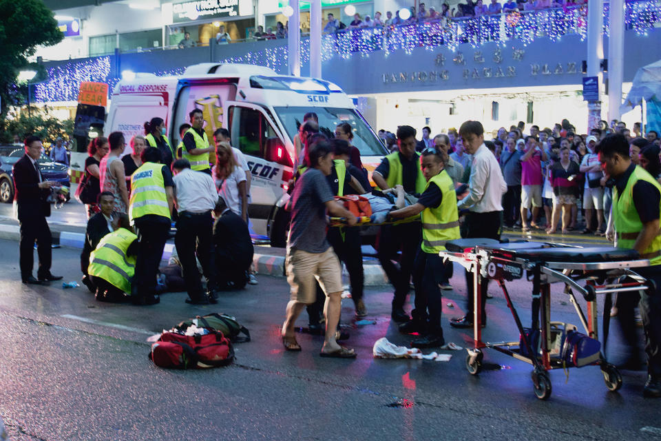 Paramedics seen assisting injured pedestrians along Tanjong Pagar Road on Thursday (7 December) evening. (PHOTO: Dhany Osman / Yahoo News Singapore)