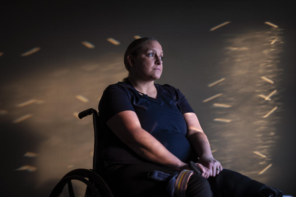 Missy Jenkins Smith, a survivor of a school shooting in 1997 which left her paralyzed, poses for a portrait at her home in Kirksey, Ky., Monday, June 5, 2023. Jenkins Smith has long warned educators and students she spoke to that no school was immune from a mass shooting. At the same time, she had told herself that her own community, having endured it once, would be OK. (AP Photo/David Goldman)