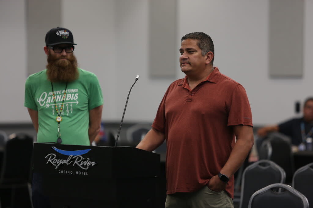 Tony Reider, president of the Flandreau Santee Sioux Tribe, speaks from a podium to the State-Tribal Relations Committee at its meeting on July 31, 2023, at the Royal River Casino. (Makenzie Huber/South Dakota Searchlight)