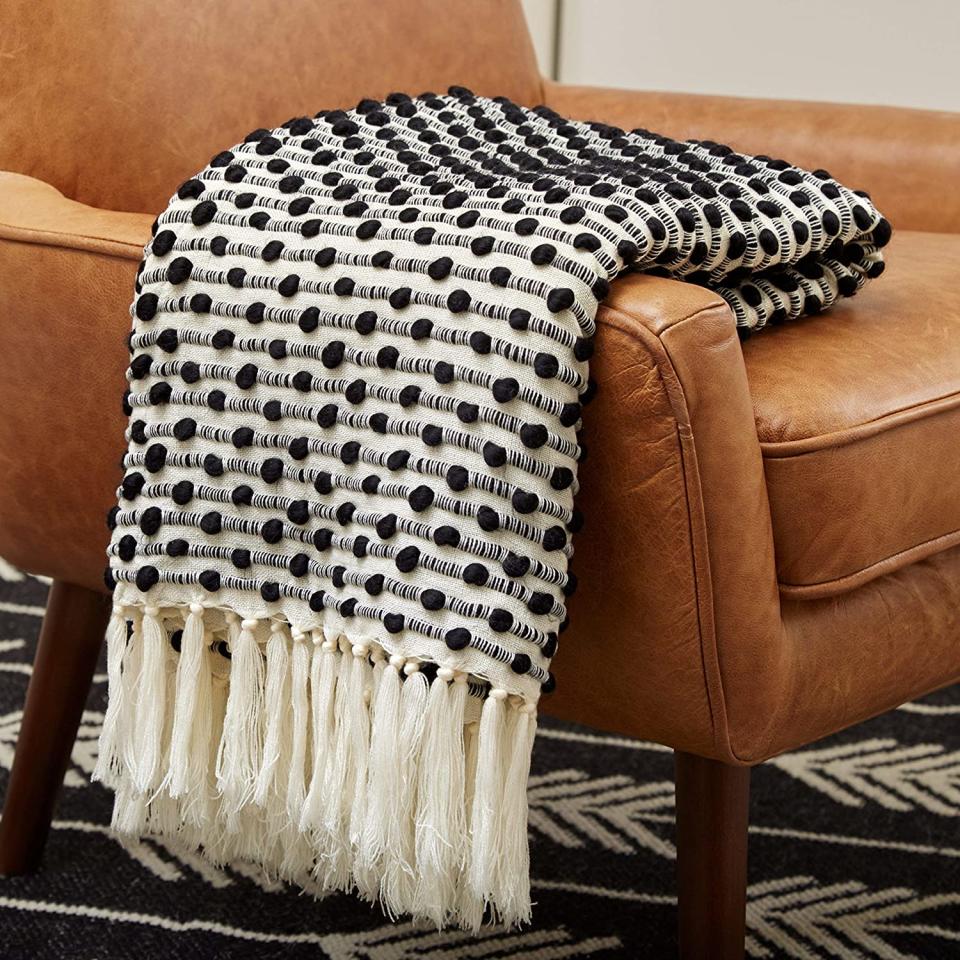 Rivet Bubble Textured Lightweight Decorative Fringe Throw Blanket. Image via Amazon. 