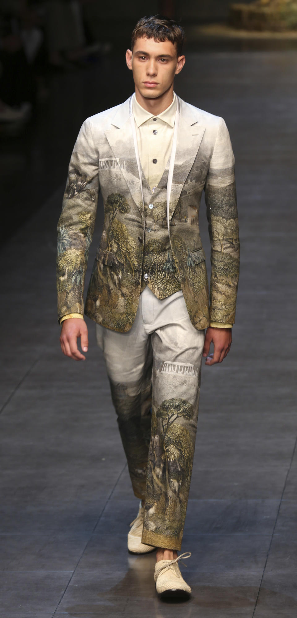 A model wears a creation of the Dolce & Gabbana men's Spring-Summer 2014 collection, part of the Milan Fashion Week, unveiled in Milan, Italy, Saturday, June 22, 2013. (AP Photo/Luca Bruno)