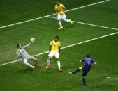 Daley Blind of the Netherlands scores past Brazil's goalkeeper Julio Cesar during their 2014 World Cup third-place playoff at the Brasilia national stadium in Brasilia July 12, 2014. REUTERS/Ruben Sprich (BRAZIL - Tags: SOCCER SPORT WORLD CUP TPX IMAGES OF THE DAY)