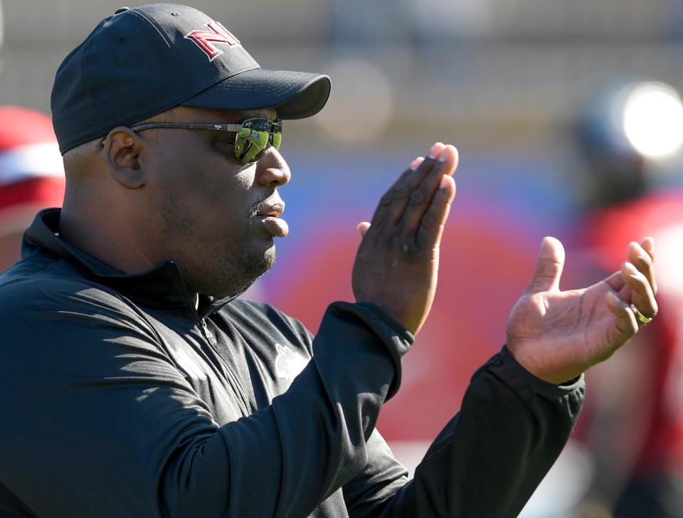 Northern Illinois Huskies head coach Thomas Hammock works his players during warm ups before the Camellia Bowl at Cramton Bowl in Montgomery, Ala., on Saturday December 23, 2023.