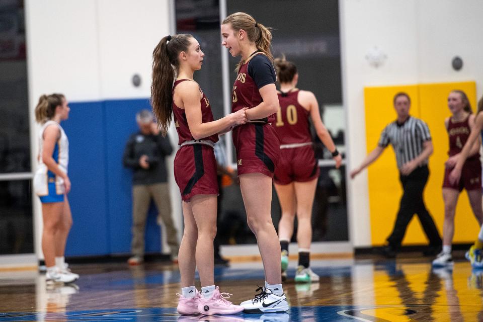 Rocky Mountain's Sara Chicco (15) talks with Kenna Wagner (1) during a game against Timnath High in Timnath on Jan. 10.