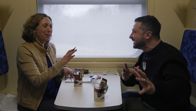 Ukrainian President Volodymyr Zelenskyy gestures during an interview with Julie Pace, senior vice president and executive editor of The Associated Press, on a train traveling from the Sumy region to Kyiv, Ukraine, Tuesday March 28, 2023. In the interview, Zelenskyy warned that unless his nation wins a drawn-out battle in the key eastern city of Bakhmut, Russia could begin building international support for a deal that could require Ukraine to make unacceptable compromises.