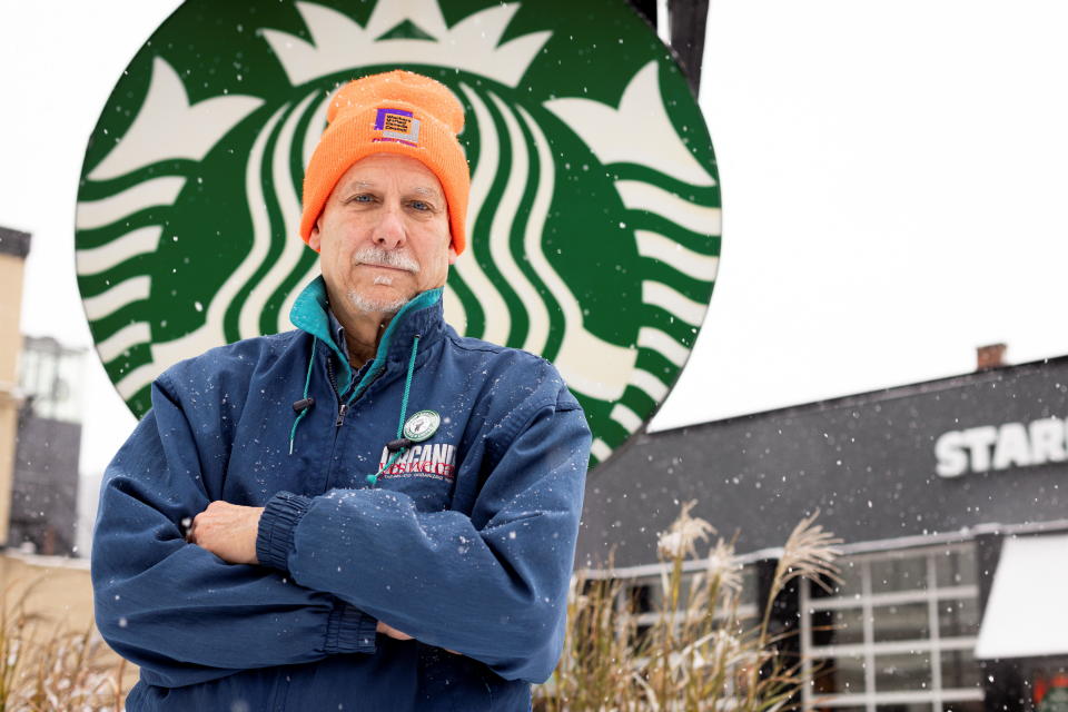 Richard Bensinger poses for portrait outside a Starbucks in Buffalo, New York, U.S., December 8, 2021.  REUTERS/Lindsay DeDario