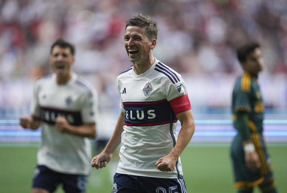 Vancouver Whitecaps' Ryan Gauld celebrates his first goal against the Los Angeles Galaxy, during the first half of an MLS soccer match Saturday, July 15, 2023, in Vancouver, British Columbia. (Darryl Dyck/The Canadian Press via AP)