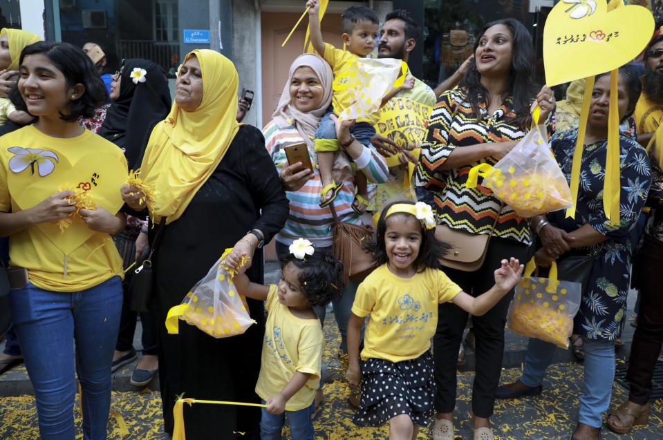 Supporters of Maldives’ former president Mohamed Nasheed, cheer upon his arrival in Maldives, Thursday, Nov.1, 2018. Nasheed, the first democratically elected president of the Maldives returned home Thursday after more than two years in exile to escape a long prison term. (AP Photo/Mohamed Sharuhaan)