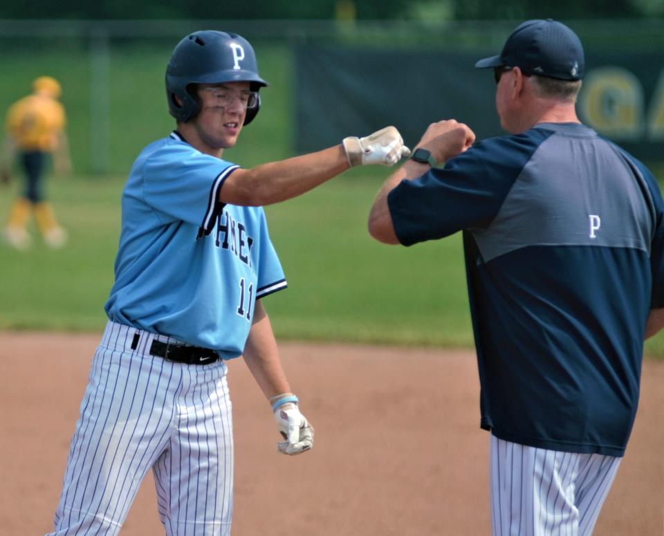 For those who make it to first base on the baseball diamond, a Mike Loper fist bump is there waiting for them.