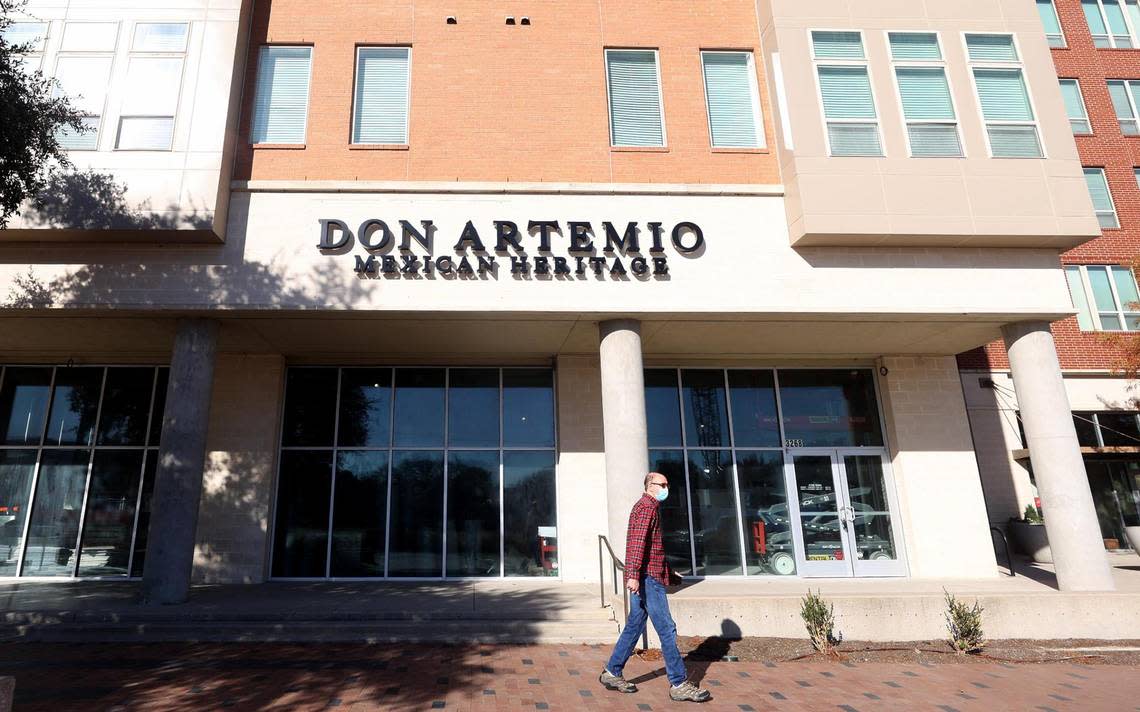 A pedestrian walks past Don Artemio.